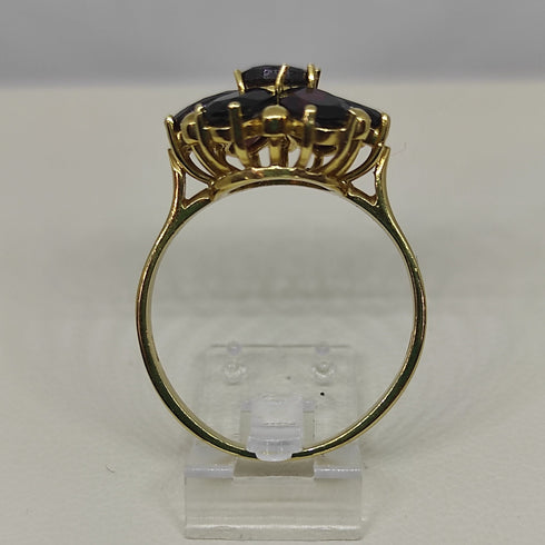 Anello oro 18 kt donna con pietre granato rosso forma Fiore | Gioiellitosti.it