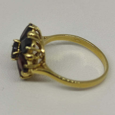 Anello oro 18 kt donna con pietre granato rosso forma Fiore | Gioiellitosti.it