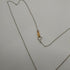 Collana Croce oro bianco 18k Diamanti 0,10 Smeraldi 0,10 | Gioiellitosti.it