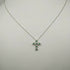 Collana Croce oro bianco 18k Diamanti 0,10 Smeraldi 0,10 | Gioiellitosti.it