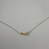Collana Croce Oro bianco 18k Diamanti 0,07 Smeraldi 0,18 | Gioiellitosti.it