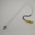 Collana Croce Oro bianco 18k Diamanti 0,07 Smeraldi 0,18 | Gioiellitosti.it